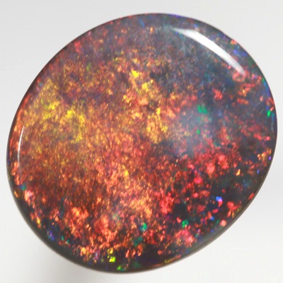 SOLID BLACK OPAL Burning golden fire, very bright! SEE VIDEO